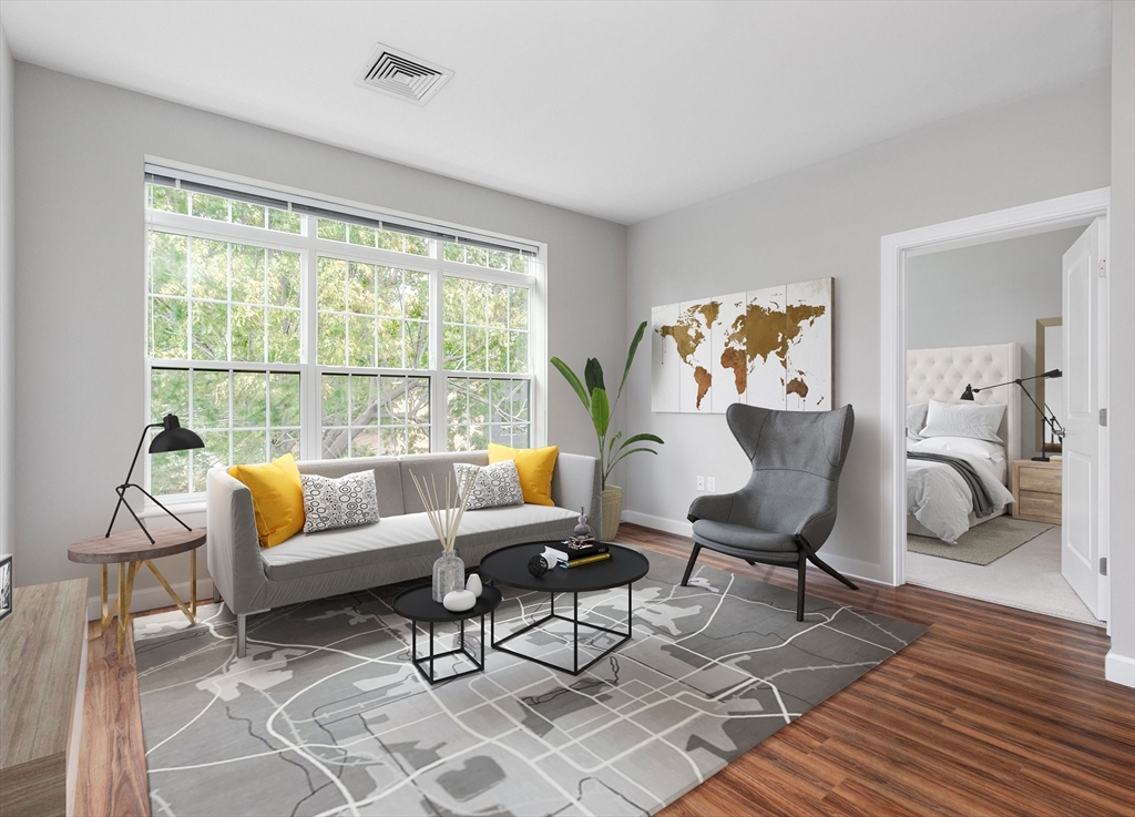 72 Flint Street, Unit 1106 Salem, MA 01970 - Photo 1 of 13 a living room with furniture and a table