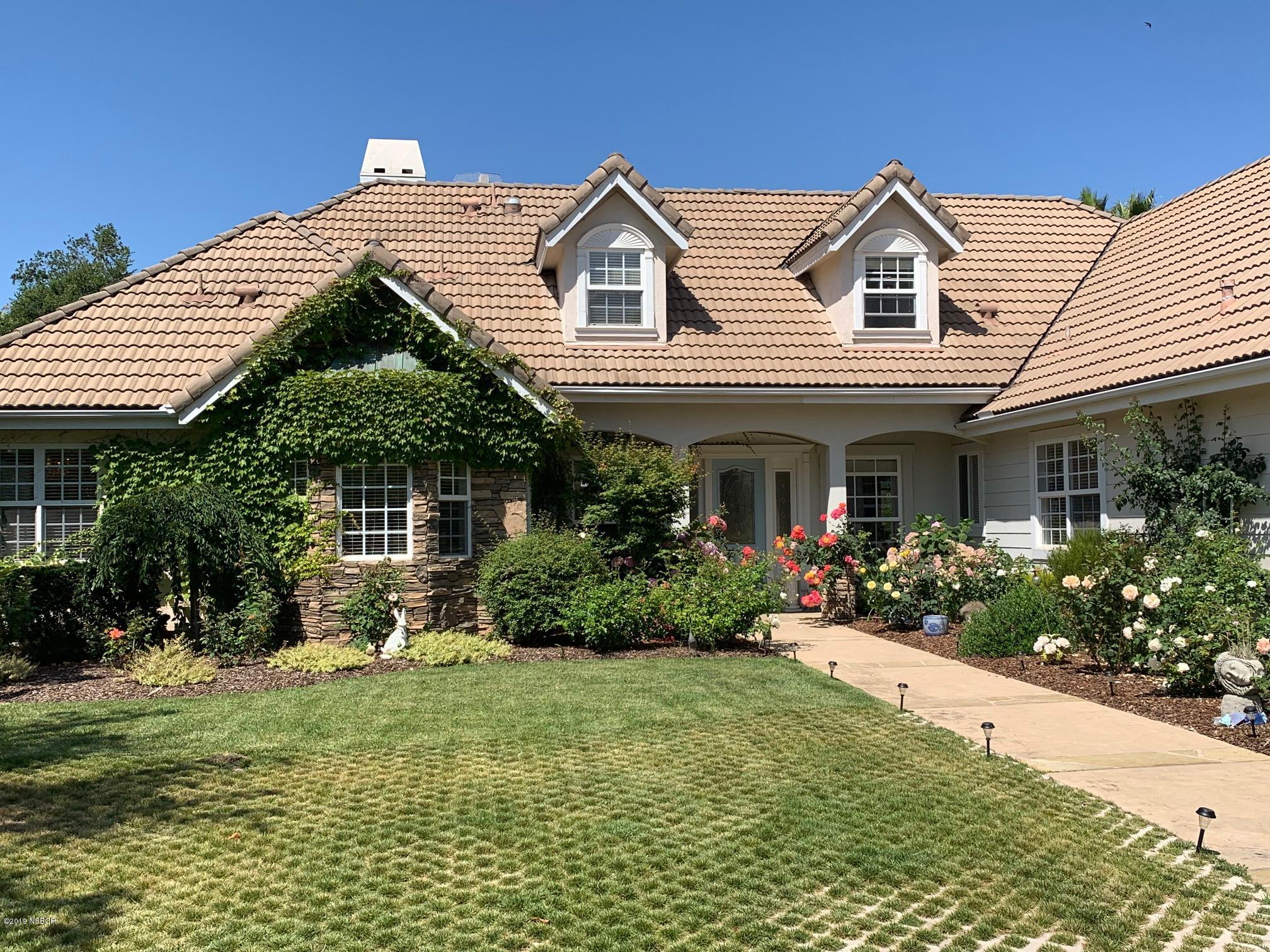 959 Old Ranch Road Solvang, CA 93463 - Photo 1 of 29 a front view of a house with garden