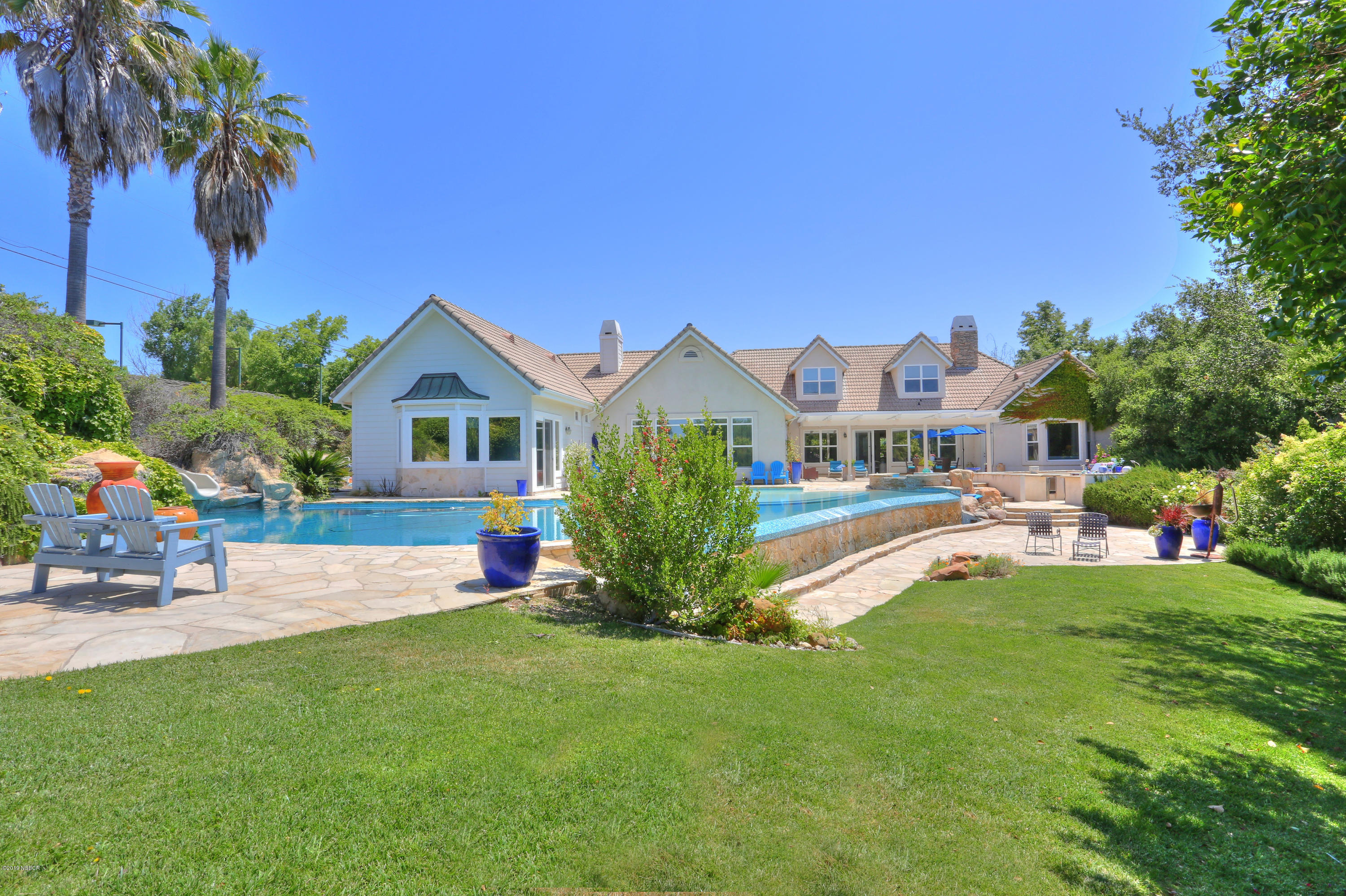 959 Old Ranch Road Solvang, CA 93463 - Photo 11 of 29 a view of house with outdoor space and swimming pool