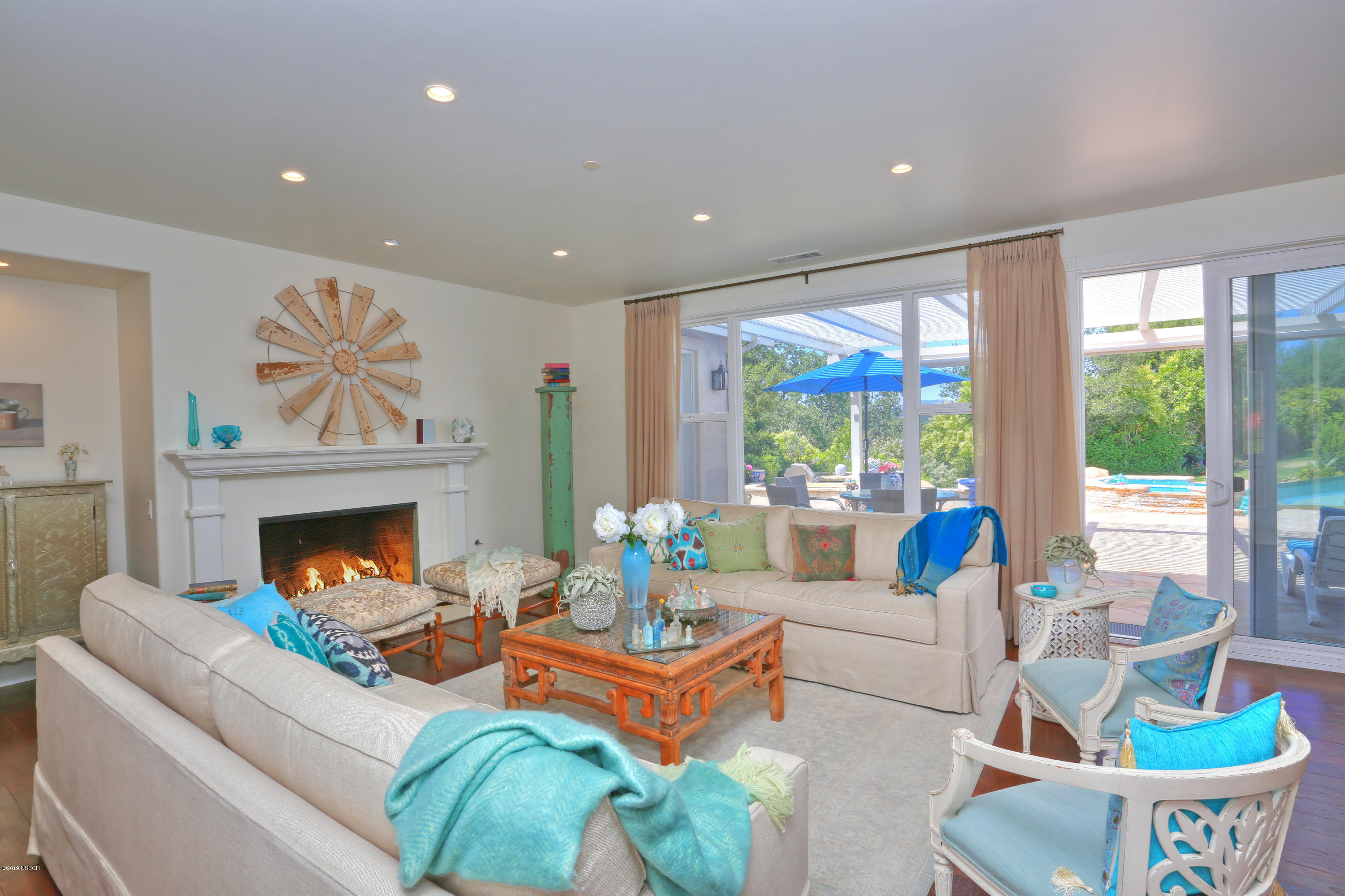 959 Old Ranch Road Solvang, CA 93463 - Photo 2 of 29 a living room with furniture fireplace and a large window