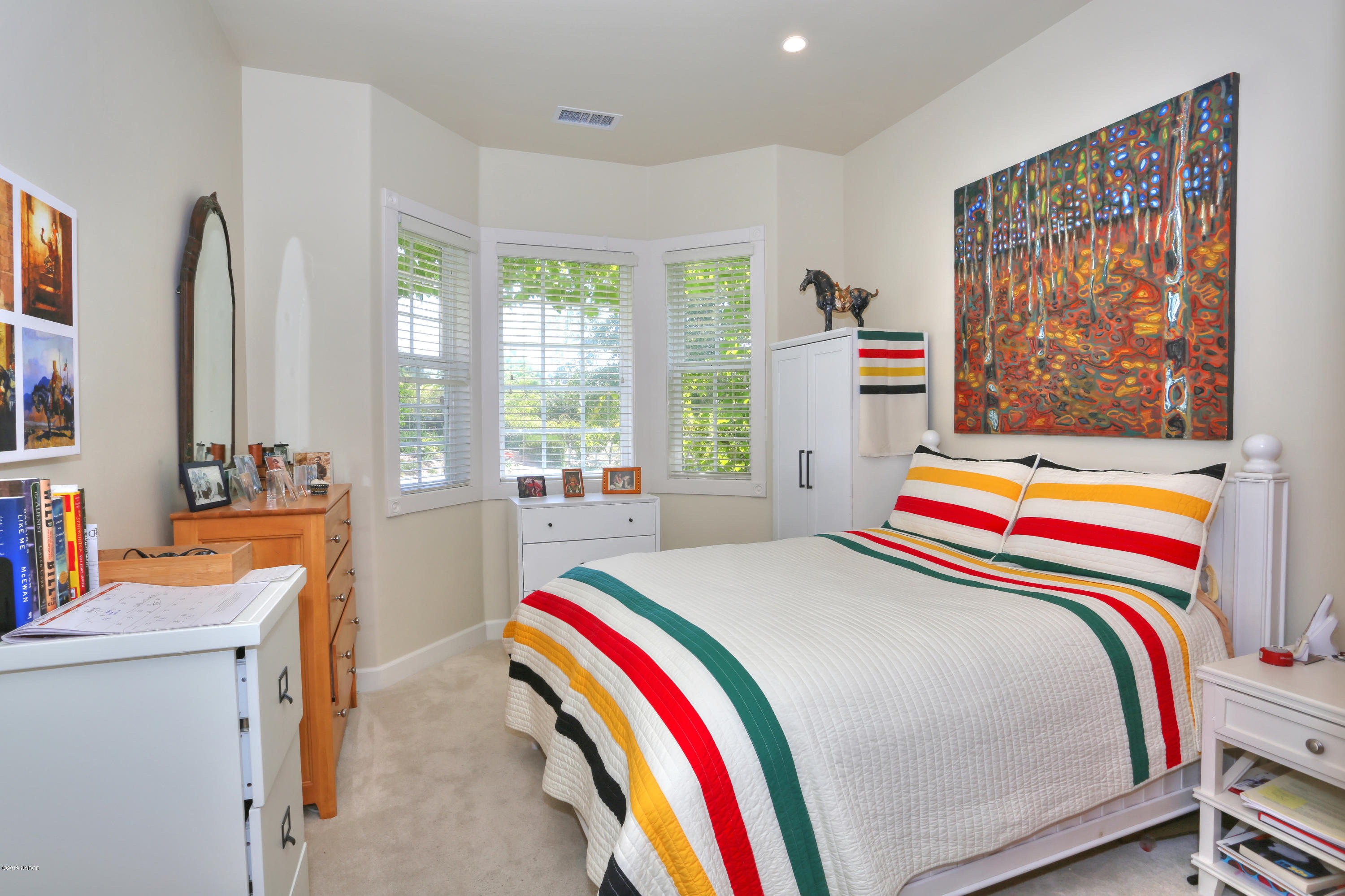 959 Old Ranch Road Solvang, CA 93463 - Photo 23 of 29 a bedroom with a bed and a flat screen tv