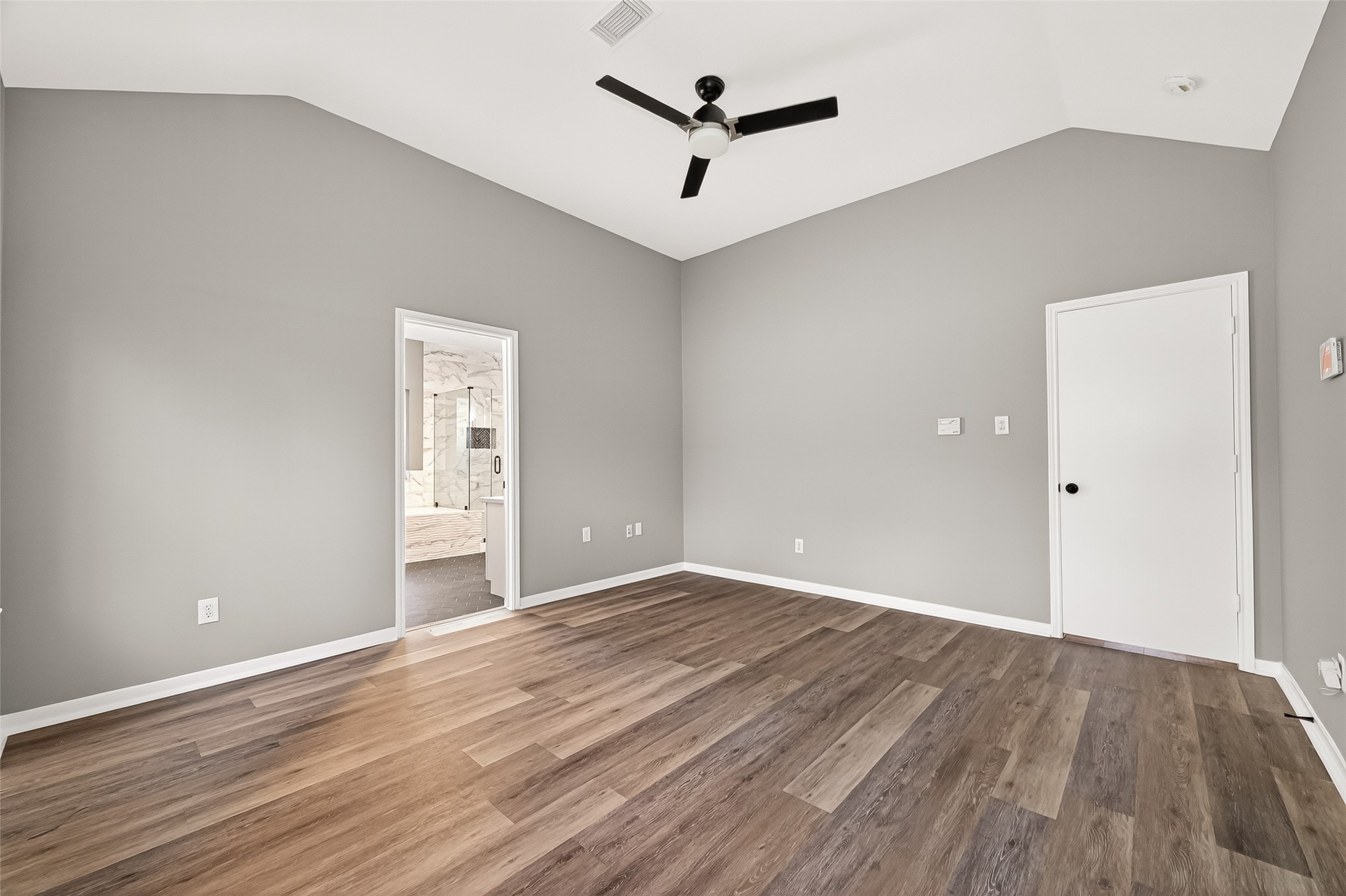 23810 Spring Way Drive Spring, TX 77373 - Photo 16 of 35 a view of a livingroom with wooden floor and a ceiling fan