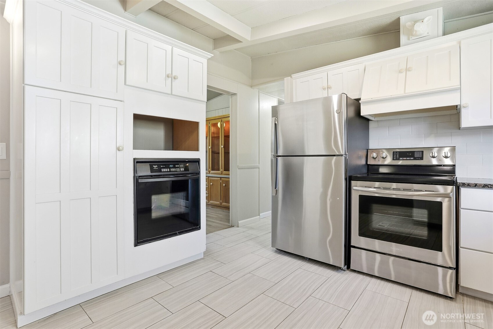 23728 Vista View Avenue Bothell, WA 98021 - Photo 12 of 40 a white refrigerator freezer and a stove sitting inside of a kitchen