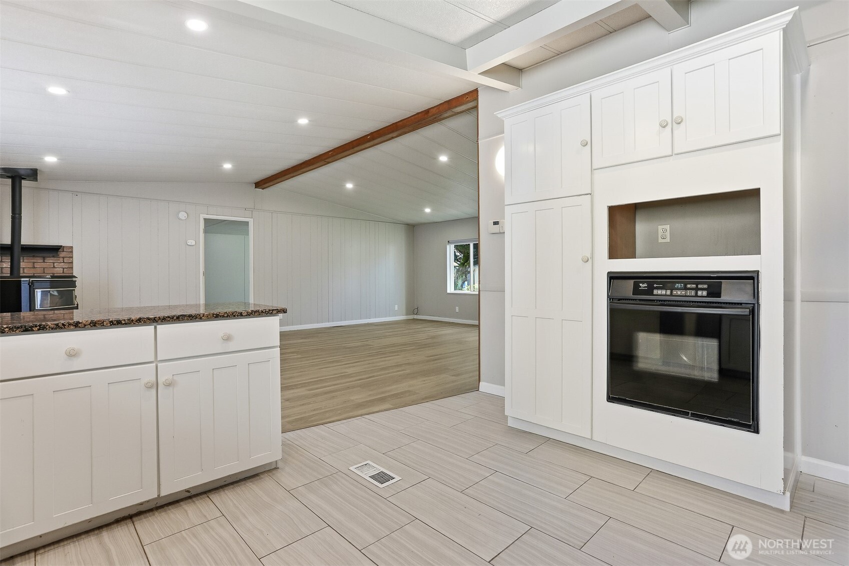 23728 Vista View Avenue Bothell, WA 98021 - Photo 14 of 40 a kitchen with stainless steel appliances kitchen island granite countertop a stove a microwave and a sink
