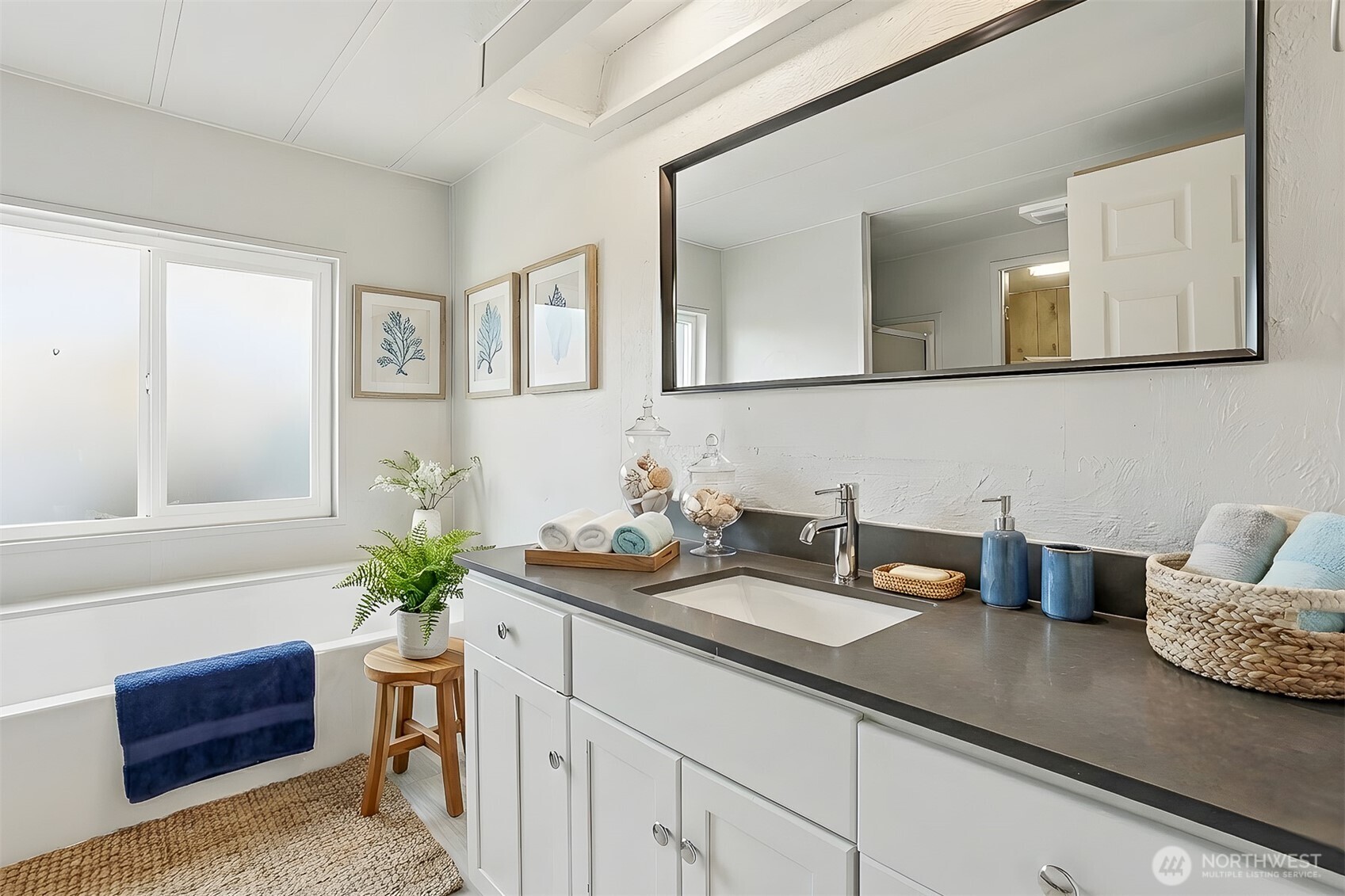 23728 Vista View Avenue Bothell, WA 98021 - Photo 18 of 40 a bathroom with a sink a vanity and mirror