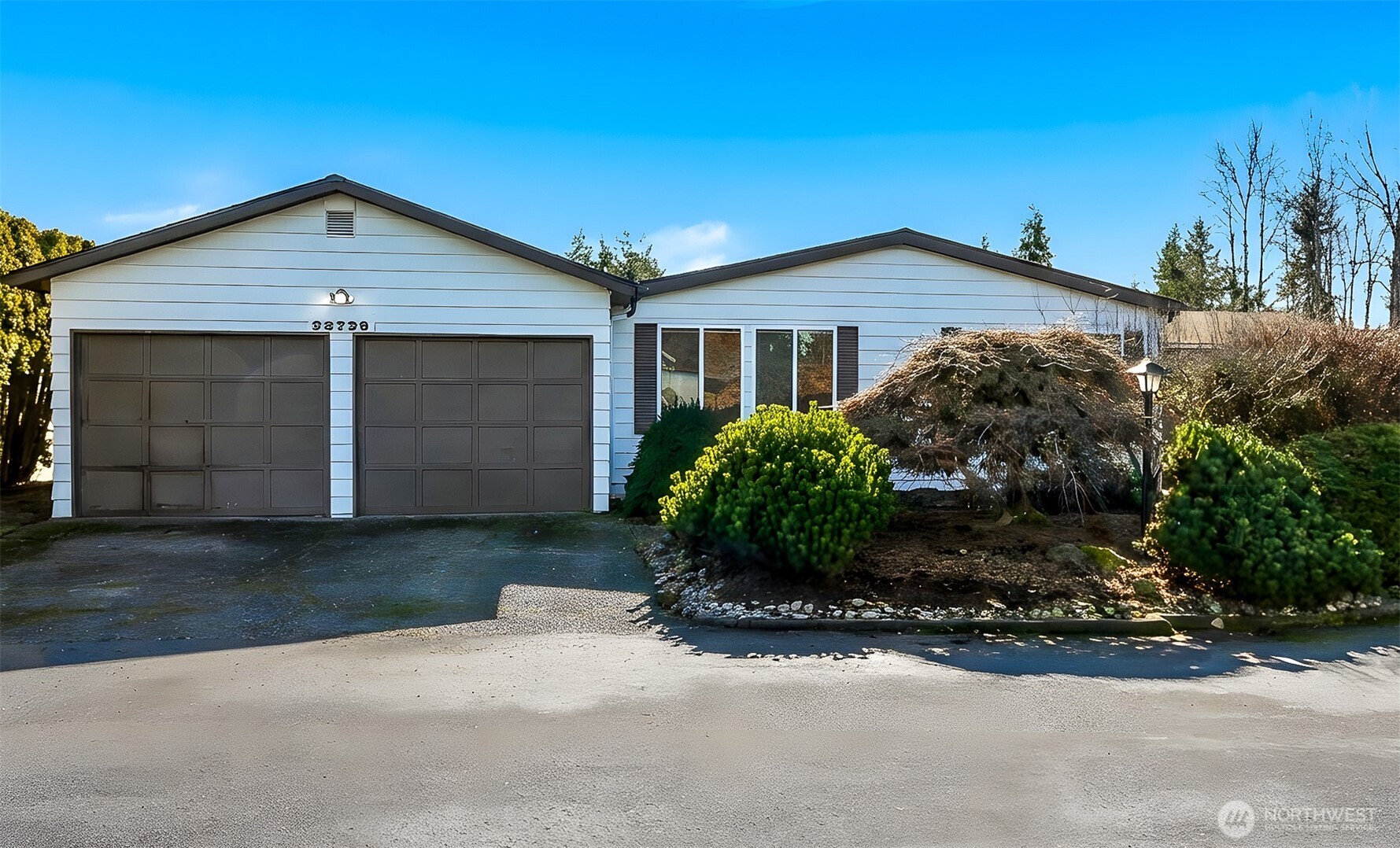 23728 Vista View Avenue Bothell, WA 98021 - Photo 2 of 40 a front view of house with yard and trees in the background