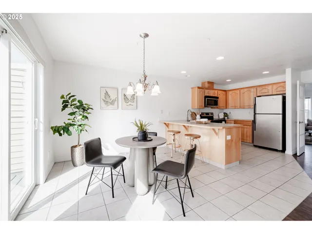 a living room with kitchen island furniture and a chandelier