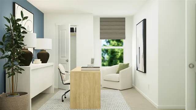 a living room with furniture and a potted plant