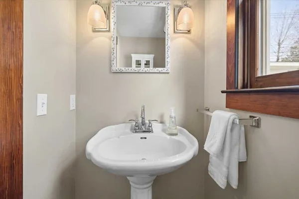 a bathroom with a sink and mirror