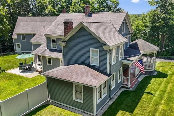 a aerial view of a house with swimming pool and porch