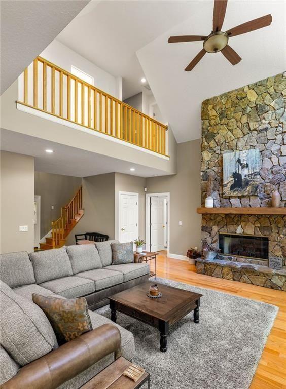 704 Riverbend Road Blairsville, GA 30512 - Photo 38 of 89 a living room with furniture a rug and a fireplace