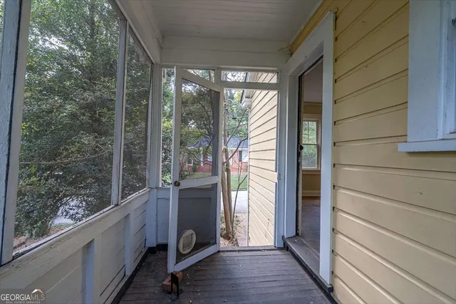 a view of balcony and wooden floor