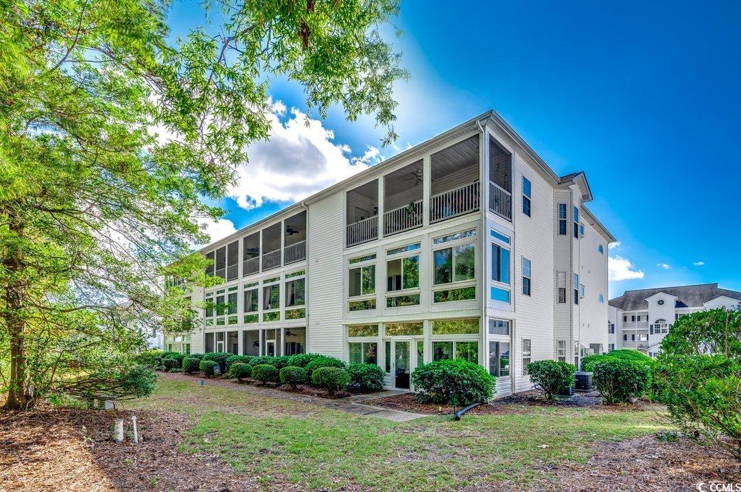 1533 Lanterns Rest Road, Unit 201 Myrtle Beach, SC 29579 - Photo 23 of 40 View of building exterior with central AC unit