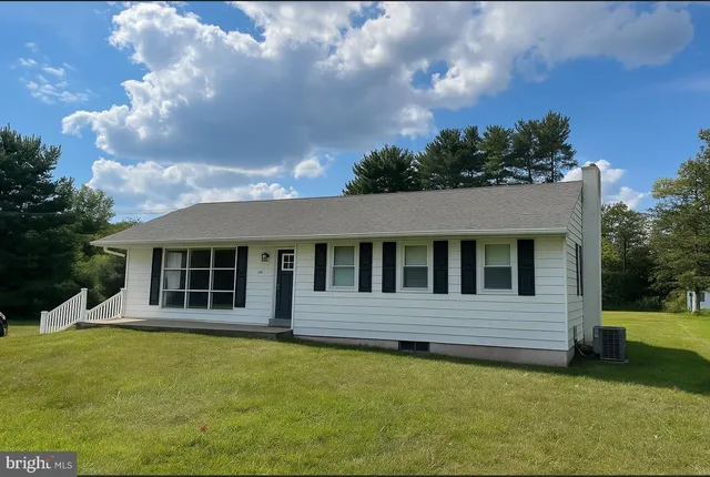 a house with trees in the background