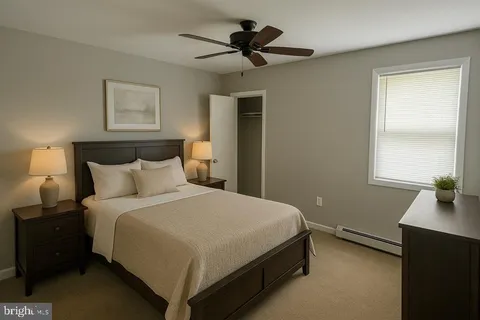 a bedroom with a bed and window