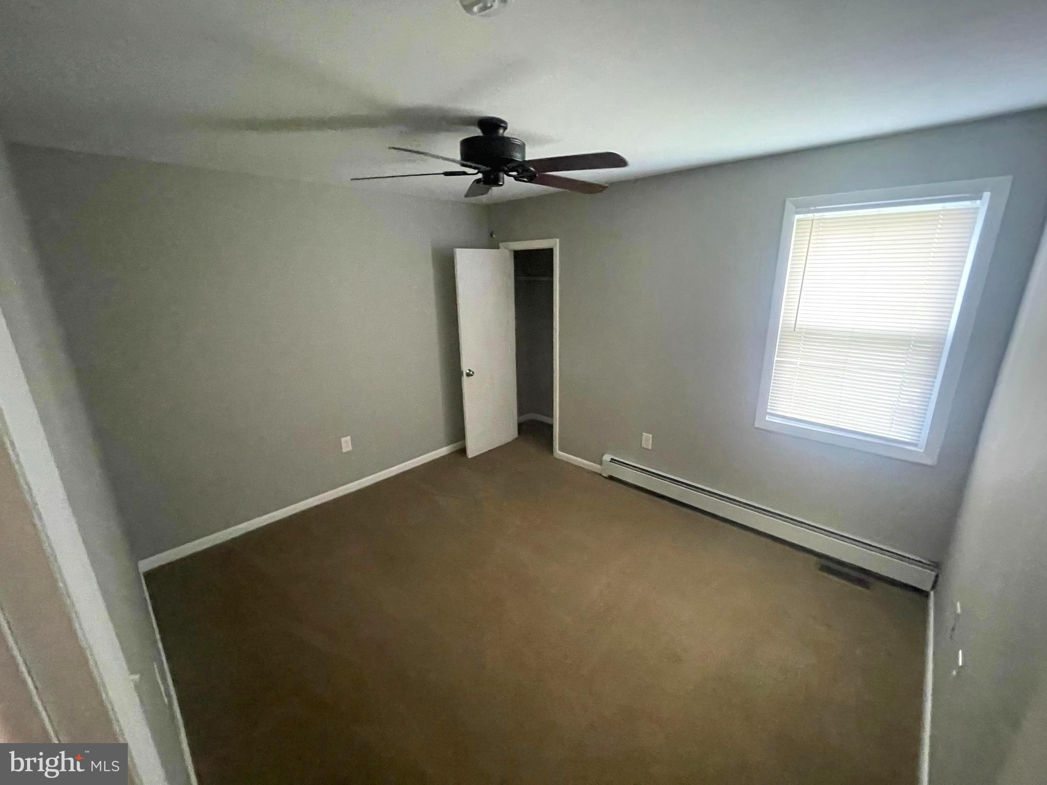 53 Sunset Road Royersford, PA 19468 - Photo 12 of 15 an empty room with a window and a fan