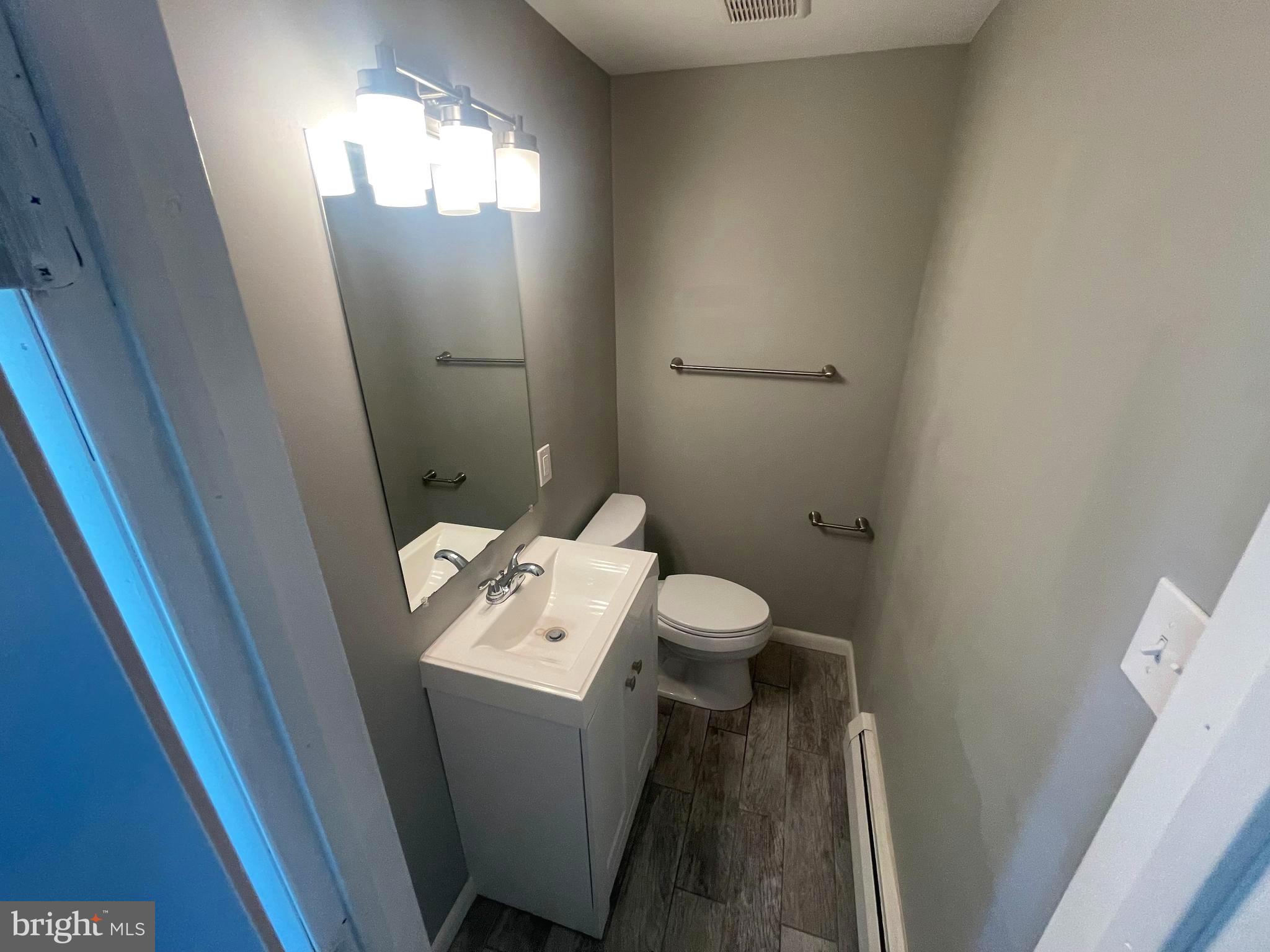 53 Sunset Road Royersford, PA 19468 - Photo 13 of 15 a bathroom with a sink a toilet and mirror