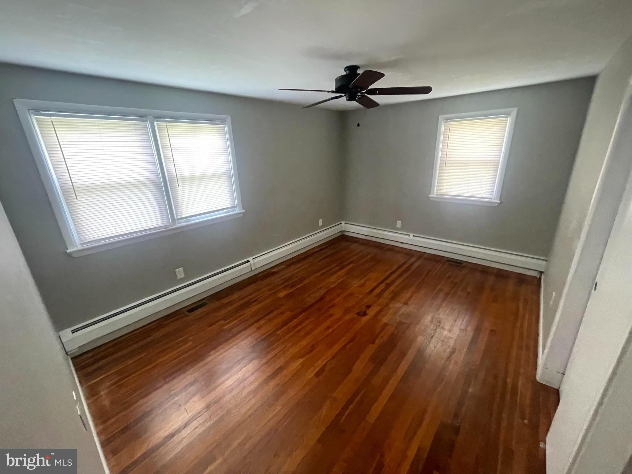 53 Sunset Road Royersford, PA 19468 - Photo 9 of 15 a view of an empty room with wooden floor and a window