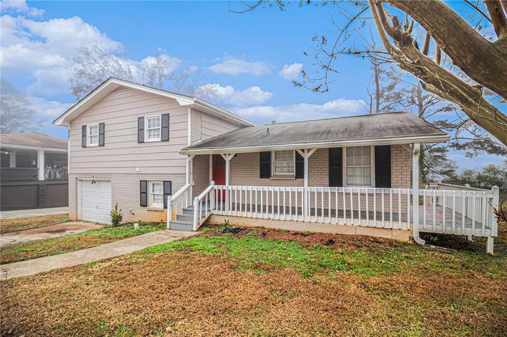4041 Emerald Lake Drive Decatur, GA 30035 - Photo 1 of 1 a front view of a house with a garden