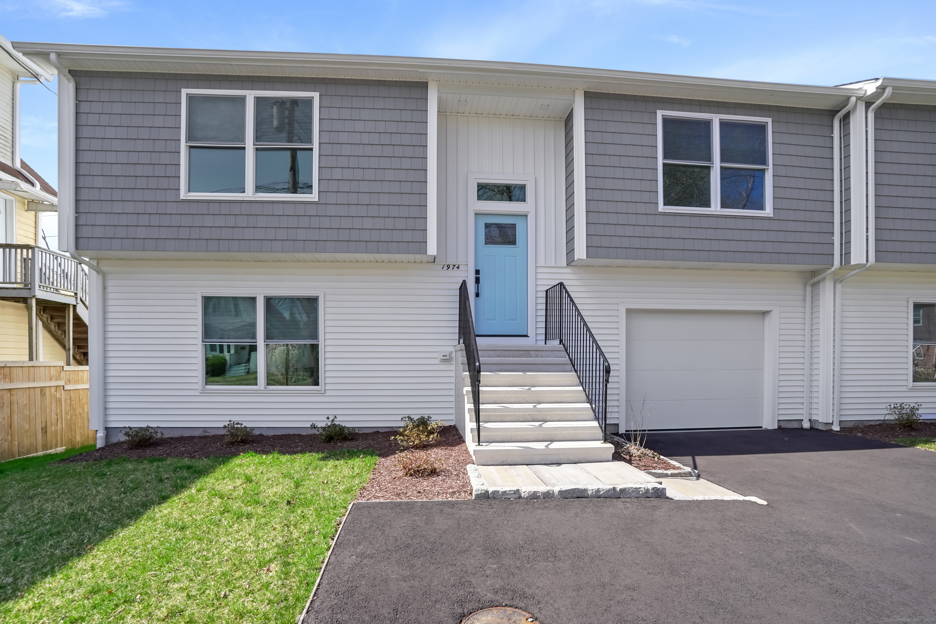1974 Kings Highway Fairfield, CT 06824 - Photo 1 of 29 a front view of a house with a garden