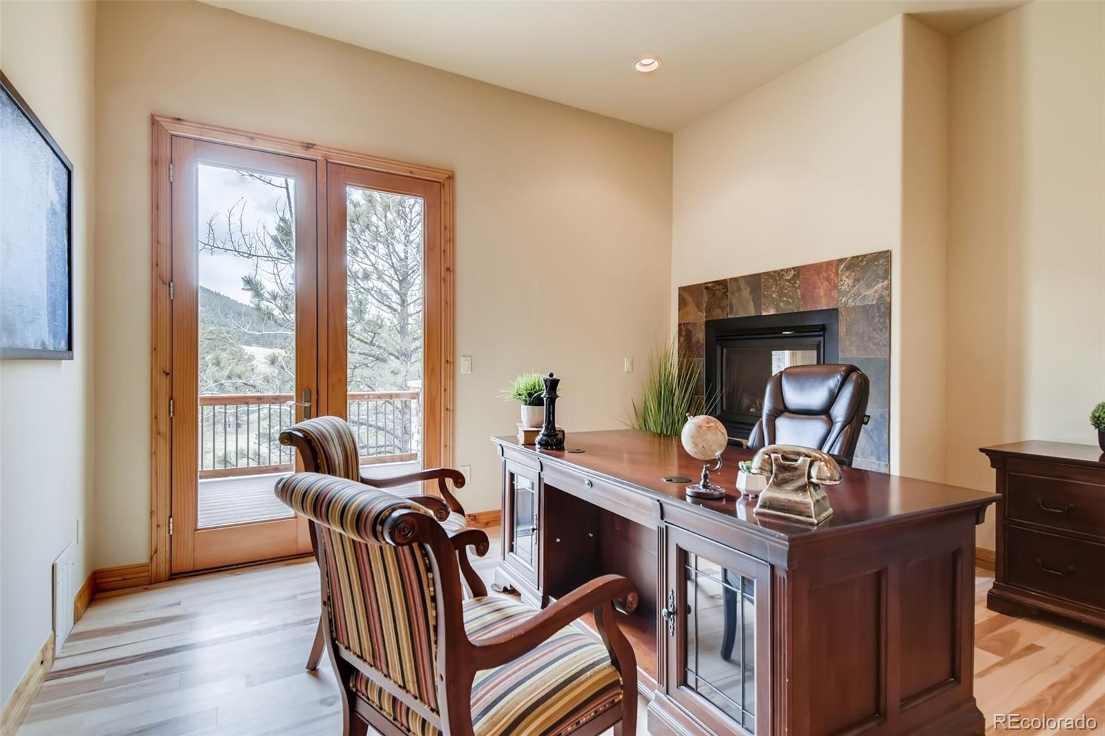 1265 Silver Rock Lane Evergreen, CO 80439 - Photo 14 of 35 a living room with furniture and a window