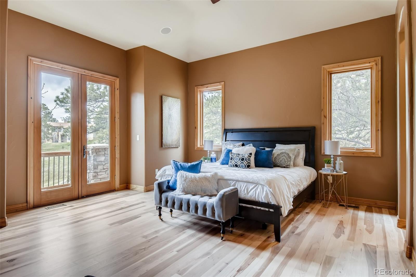 1265 Silver Rock Lane Evergreen, CO 80439 - Photo 15 of 35 a bedroom with a bed and a large window