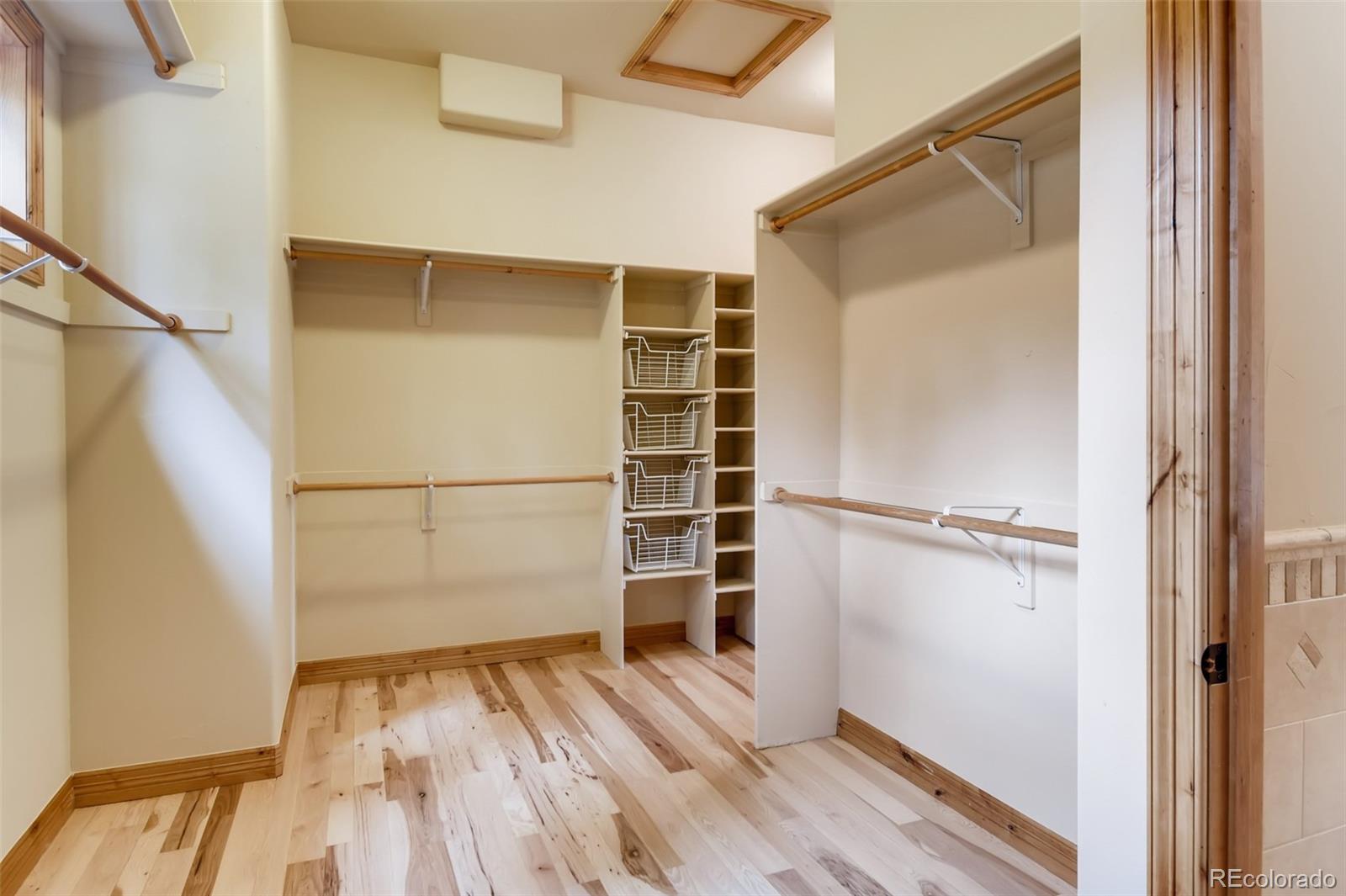 1265 Silver Rock Lane Evergreen, CO 80439 - Photo 18 of 35 a view of walk in closet with empty racks