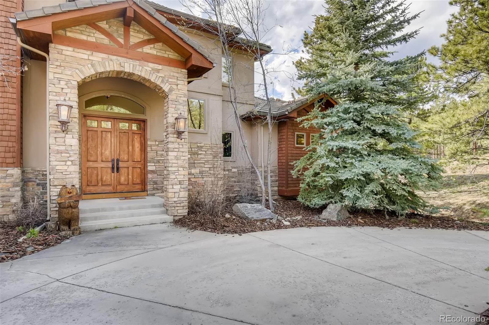 1265 Silver Rock Lane Evergreen, CO 80439 - Photo 6 of 35 a view of entrance gate of a house