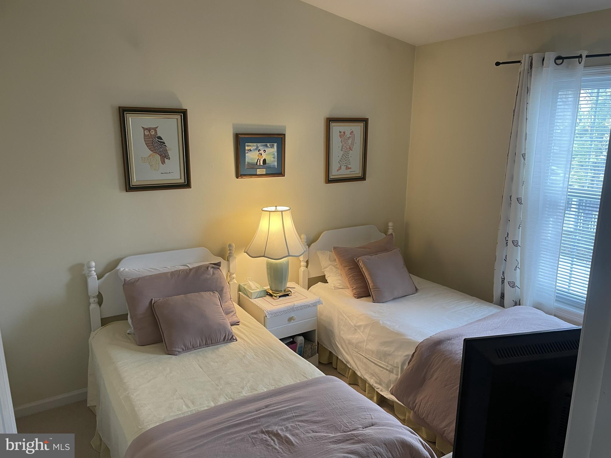 7359 Point Patience Way Elkridge, MD 21075 - Photo 14 of 23 a bedroom with two beds and a lamp on the dresser