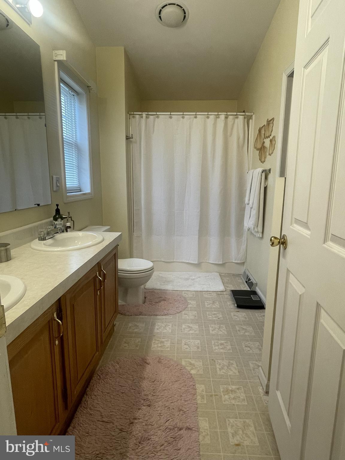 7359 Point Patience Way Elkridge, MD 21075 - Photo 17 of 23 a bathroom with a sink a toilet and shower