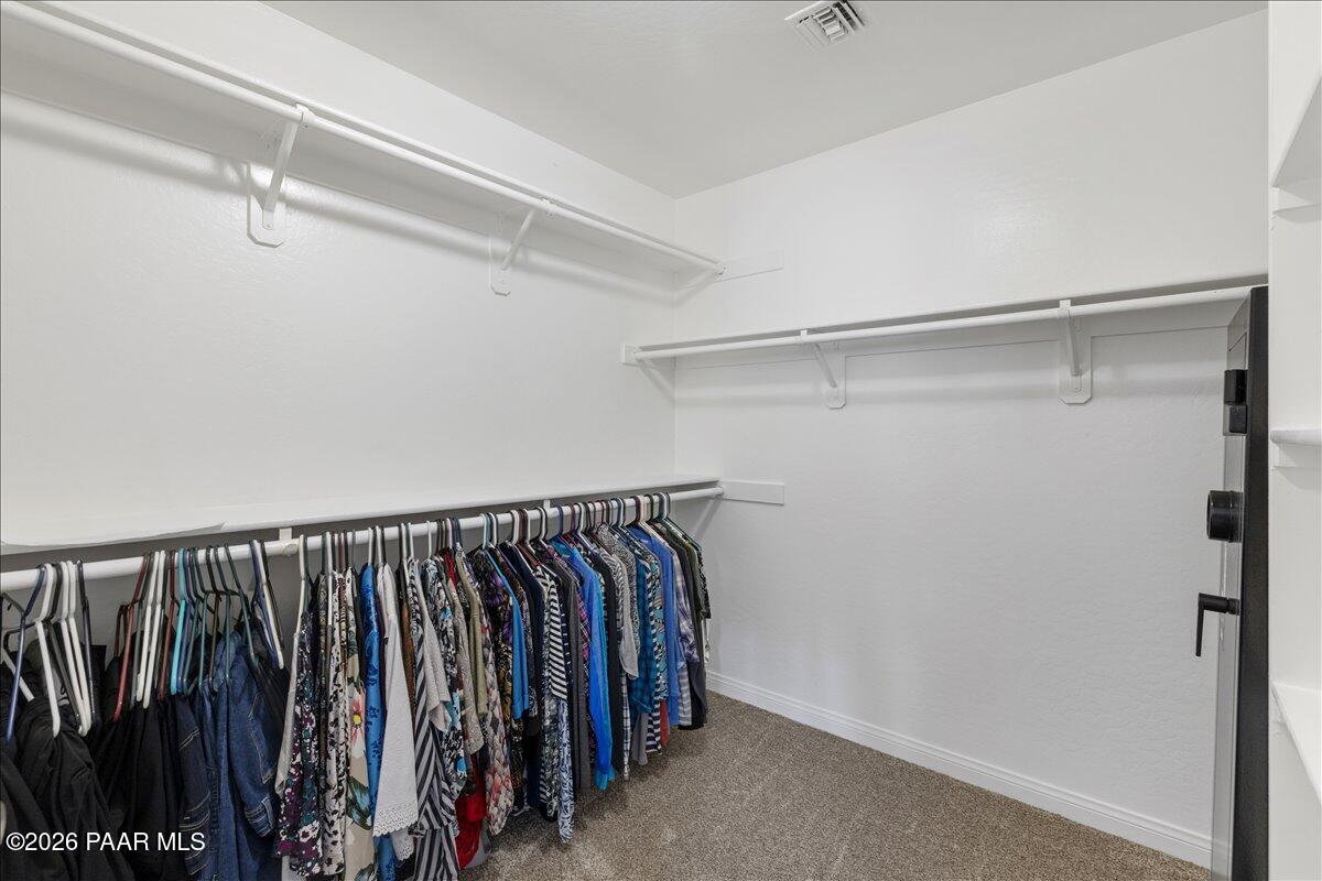 4701 North Spring Drive Prescott Valley, AZ 86314 - Photo 19 of 31 a view of walk in closet with clothes