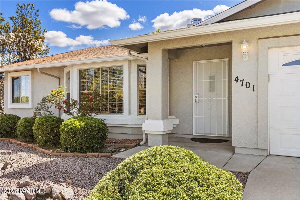 4701 North Spring Drive Prescott Valley, AZ 86314 - Photo 2 of 31 a view of a house with potted plants