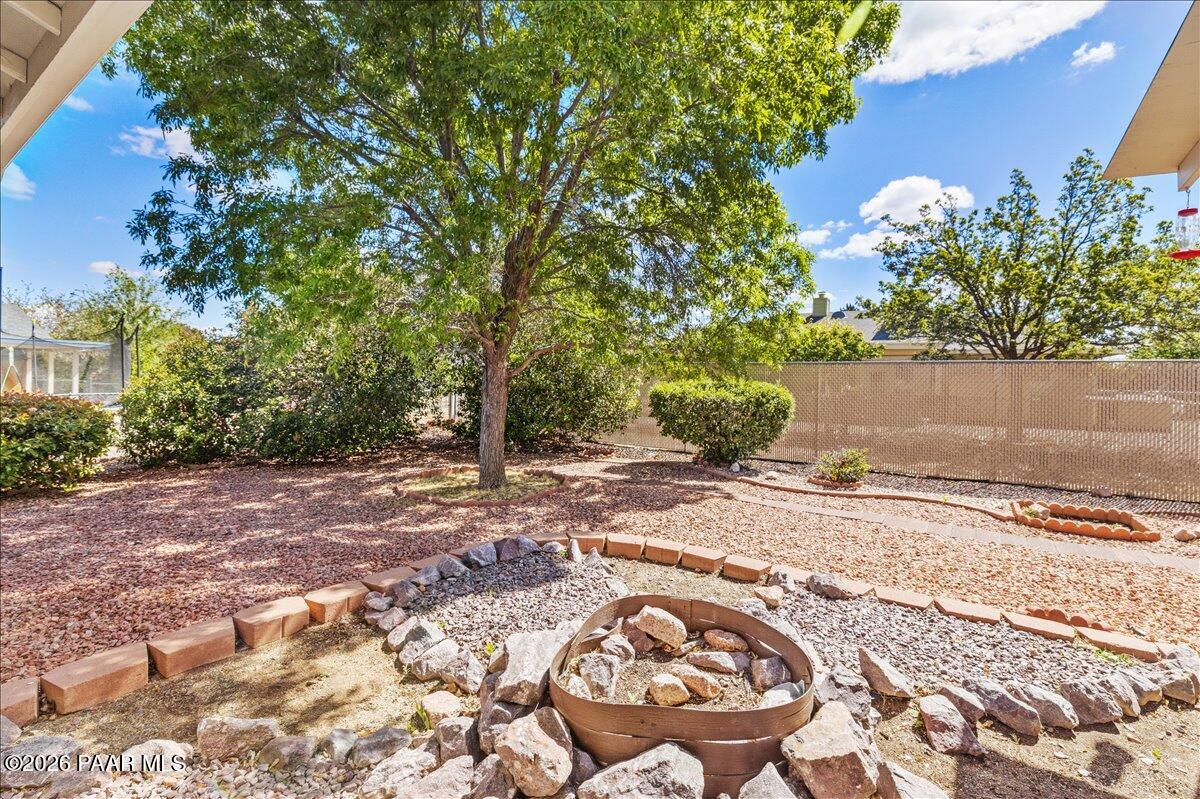 4701 North Spring Drive Prescott Valley, AZ 86314 - Photo 25 of 31 a view of a yard with plants and trees