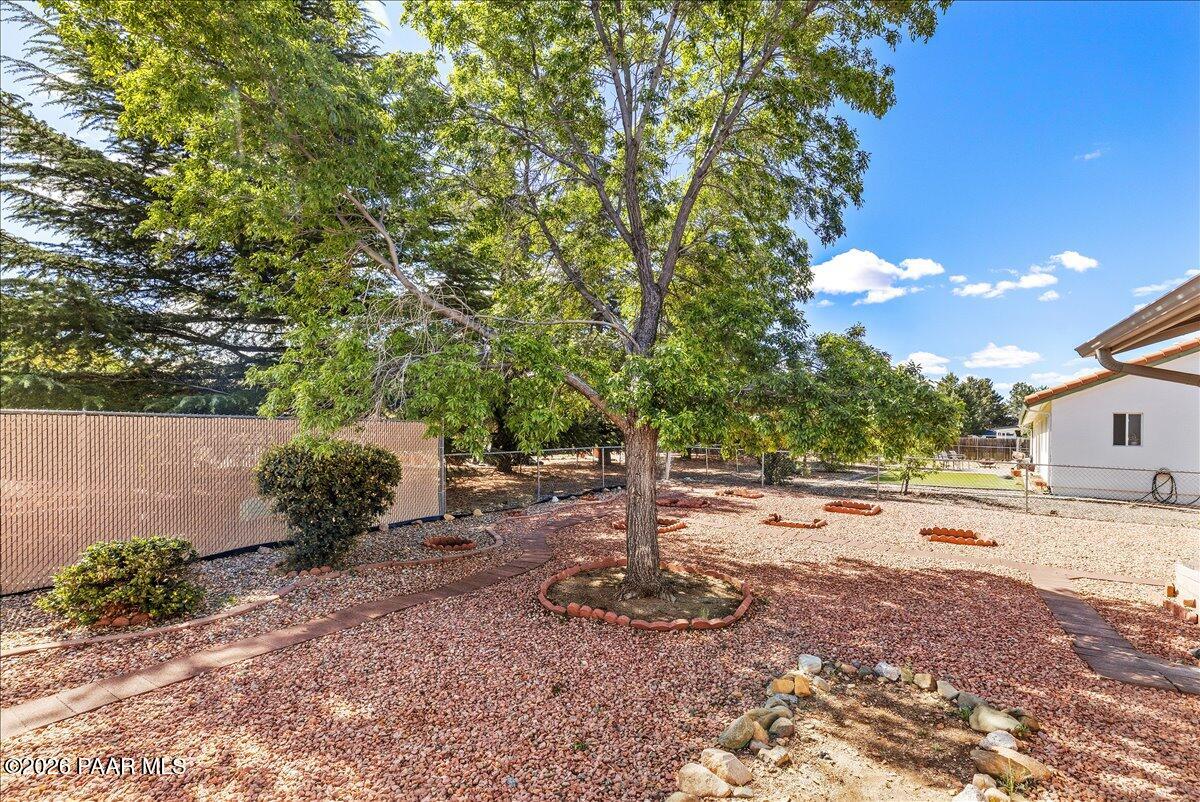 4701 North Spring Drive Prescott Valley, AZ 86314 - Photo 27 of 31 a backyard of a house with a tree