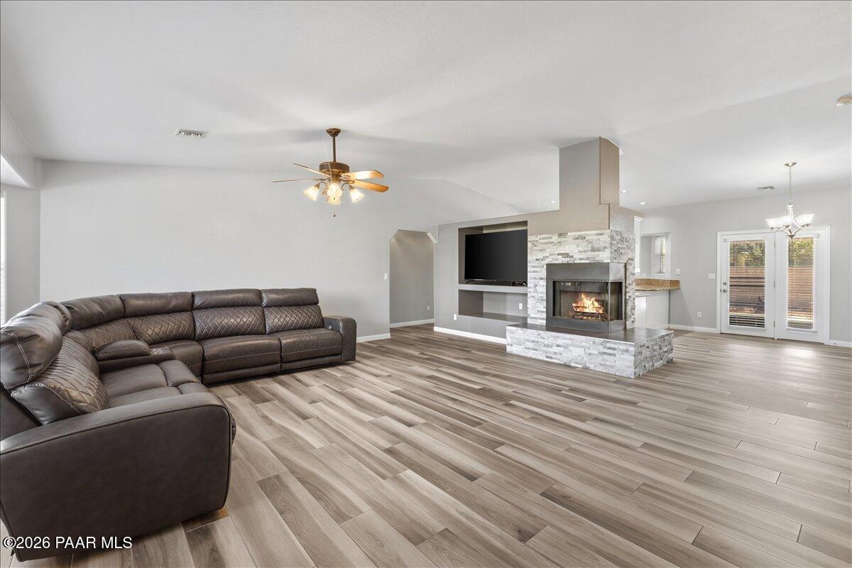4701 North Spring Drive Prescott Valley, AZ 86314 - Photo 3 of 31 a living room with furniture and a fireplace