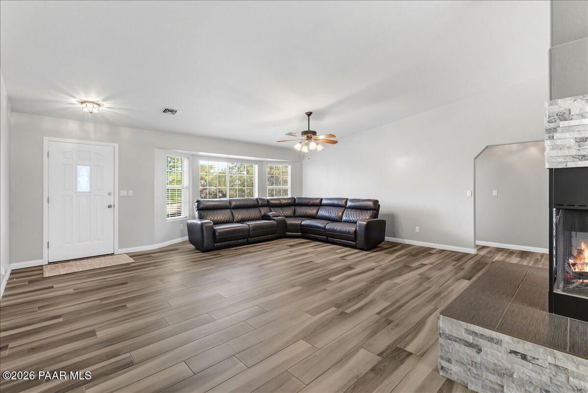 4701 North Spring Drive Prescott Valley, AZ 86314 - Photo 6 of 31 a living room with furniture and a chandelier