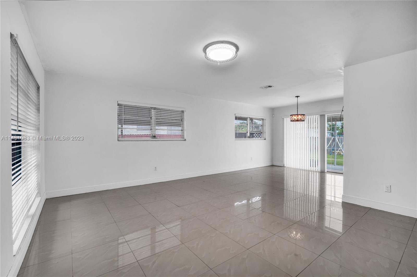 12371 Southwest 191st Street Miami, FL 33177 - Photo 1 of 19 wooden floor in an empty room