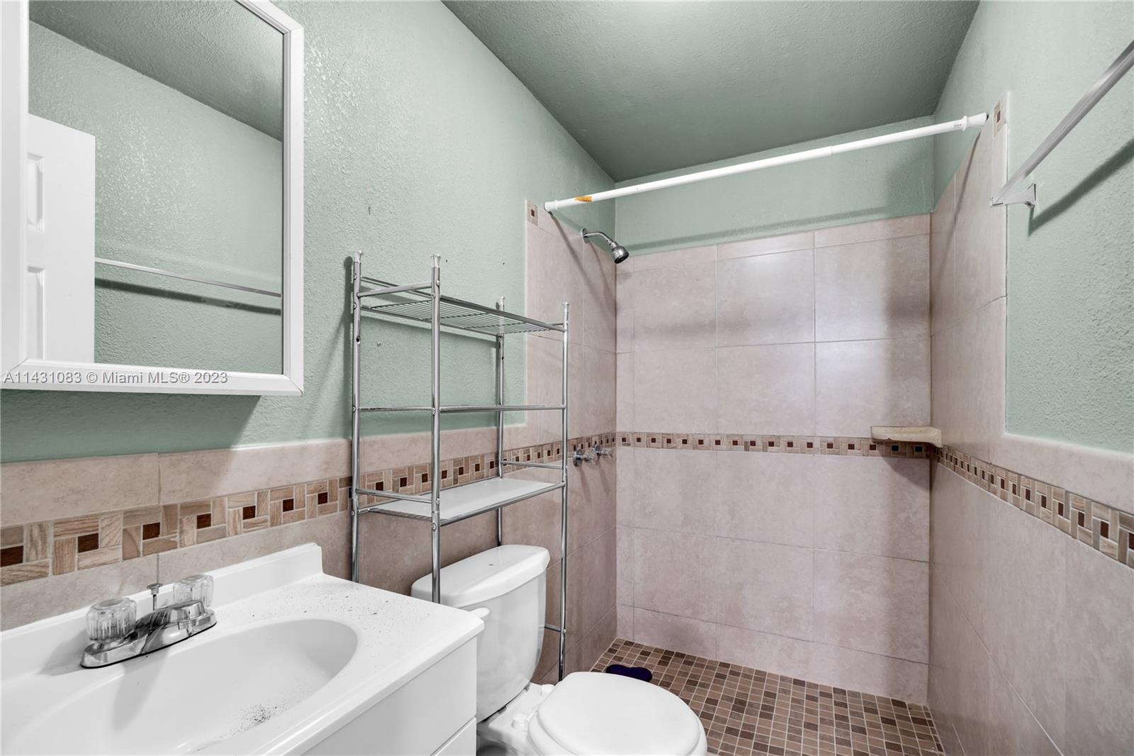 12371 Southwest 191st Street Miami, FL 33177 - Photo 12 of 19 a bathroom with a sink toilet and shower