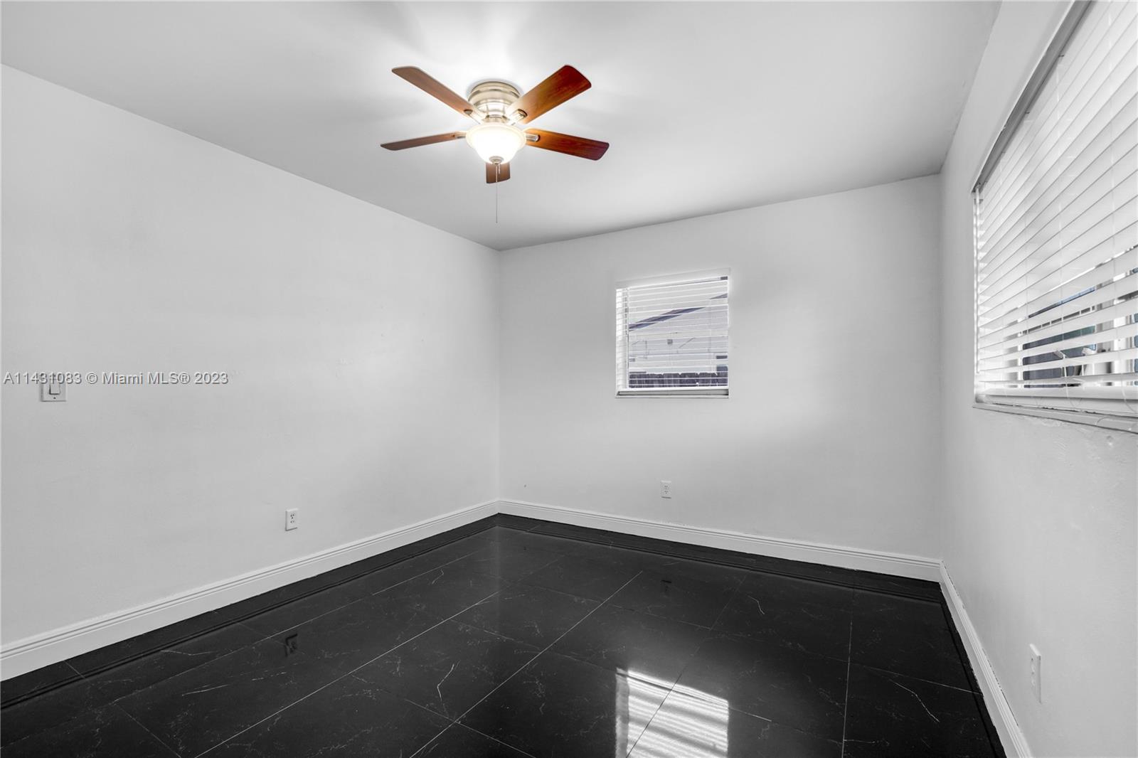 12371 Southwest 191st Street Miami, FL 33177 - Photo 15 of 19 an empty room with a window