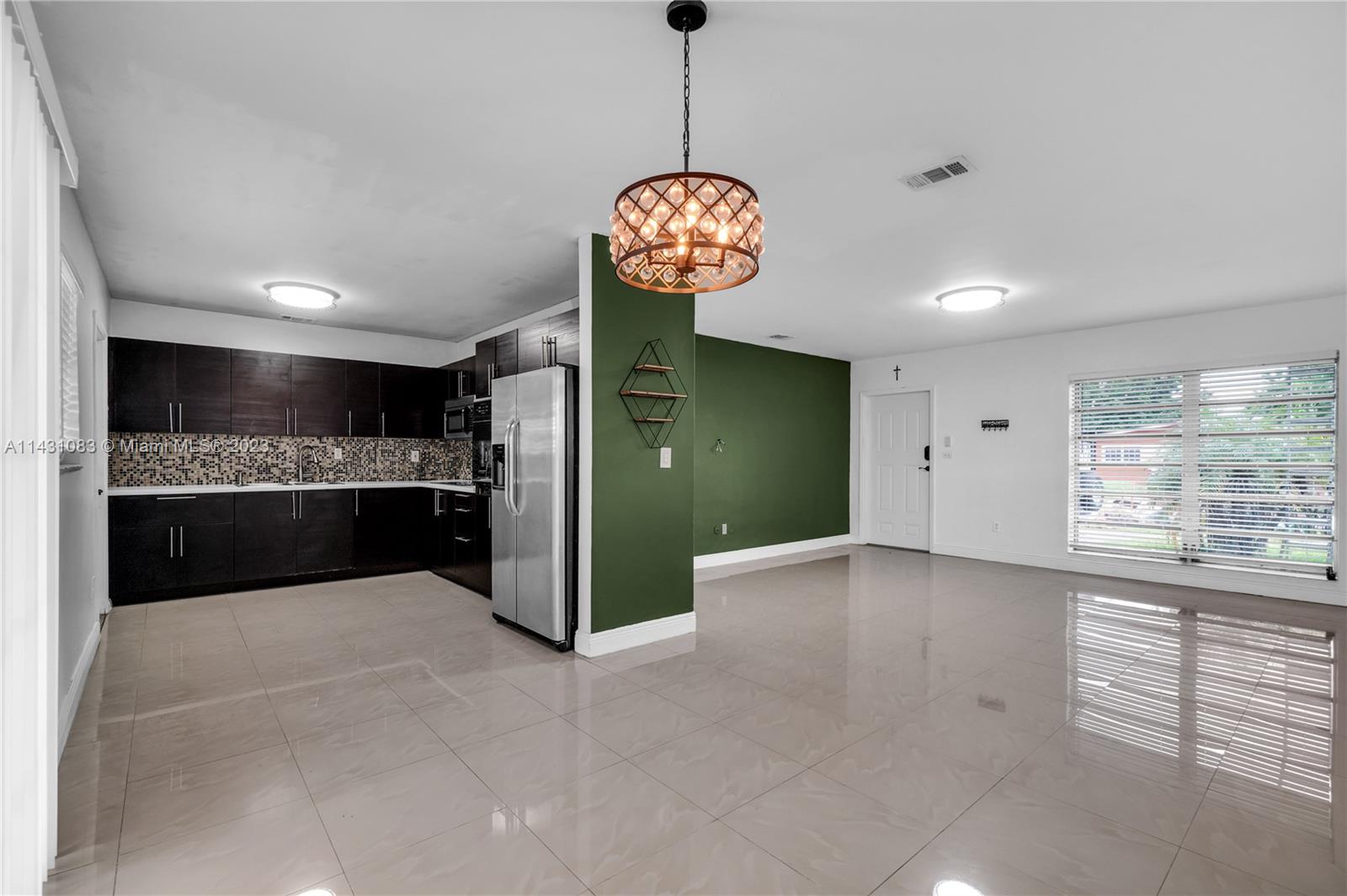 12371 Southwest 191st Street Miami, FL 33177 - Photo 3 of 19 a view of a kitchen with a sink and a window