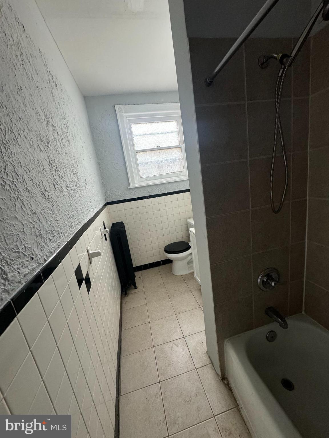 4660 Castor Avenue, Unit 2 Philadelphia, PA 19124 - Photo 9 of 11 a bathroom with a bathtub and shower