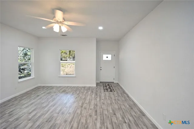 a kitchen with stainless steel appliances a stove a sink and a refrigerator