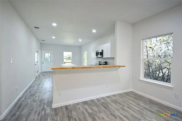 wooden floor in a hall with an entryway