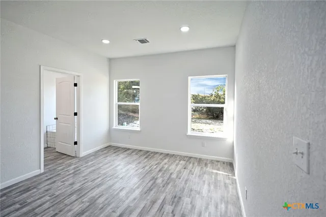 a bathroom with a granite countertop toilet a sink and bathtub