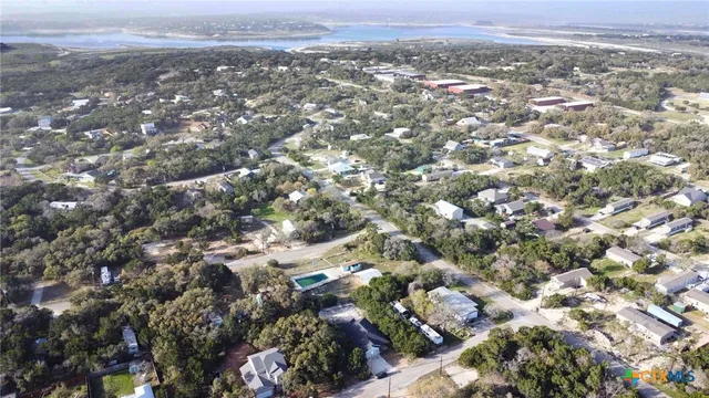 a view of a big house with a big yard