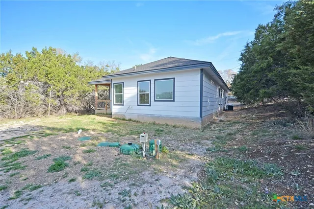 a large kitchen with stainless steel appliances granite countertop a stove a sink and a refrigerator