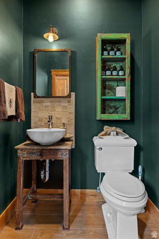 105 River Bend Circle, Unit 105 Springdale, UT 84767 - Photo 19 of 56 Bathroom featuring wood-finish flooring and deep green walls