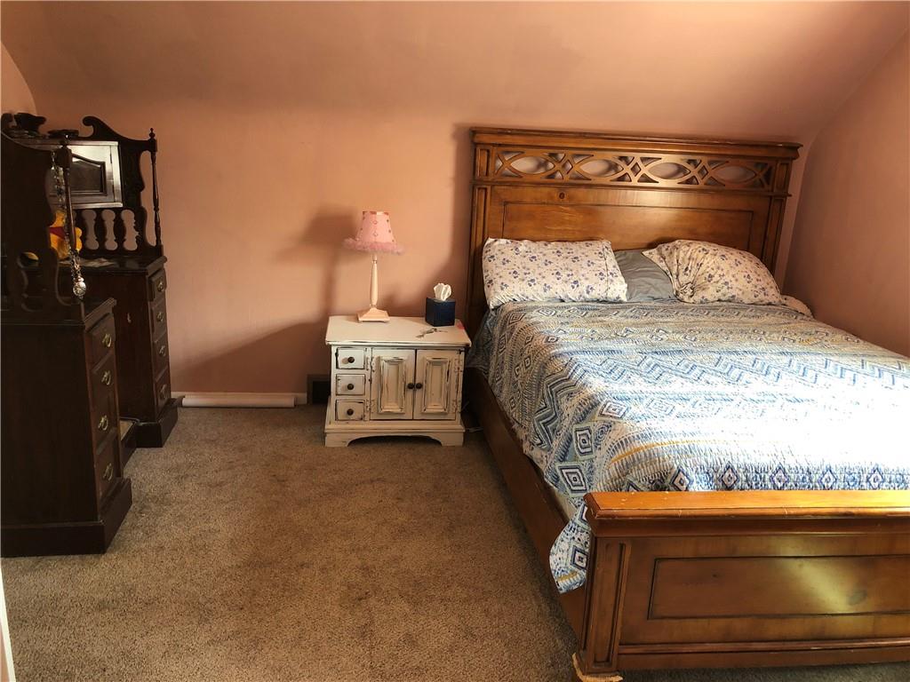 905 Braddock Road Pittsburgh, PA 15221 - Photo 14 of 20 a bedroom with a bed and dresser