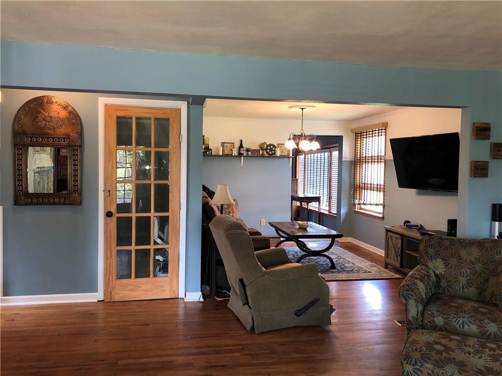905 Braddock Road Pittsburgh, PA 15221 - Photo 3 of 20 a living room with furniture and a flat screen tv