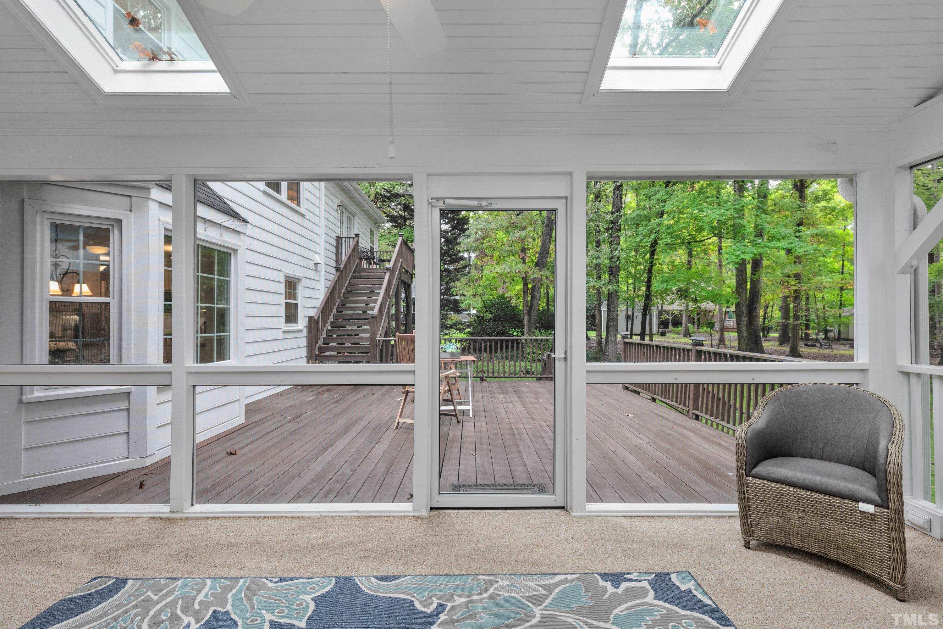 3605 Penhurst Place Raleigh, NC 27613 - Photo 14 of 30 a view of a living room hardwood floor and a large window